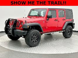 2015 Jeep Wrangler Unlimited with Firecracker Red Clear Coat Exterior